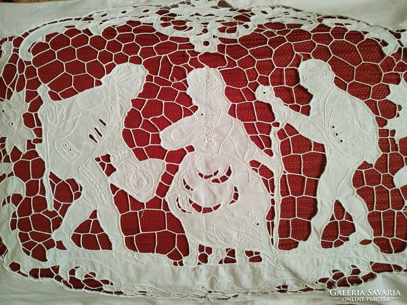 An old decorative cushion cover with a hinged scene