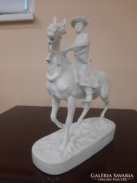 White Herend mounted hussar, porcelain figure on foal horse