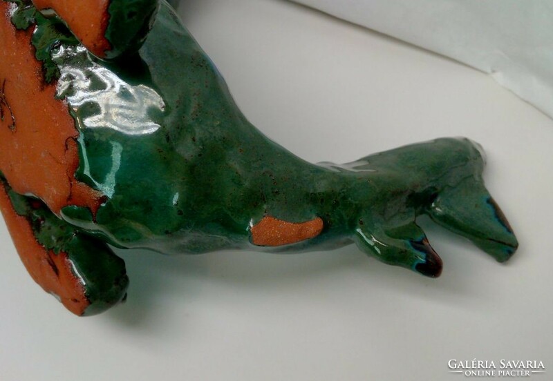 A monster of a dragon lying on its back. Ceramic candle holder Steffi Herz Germany