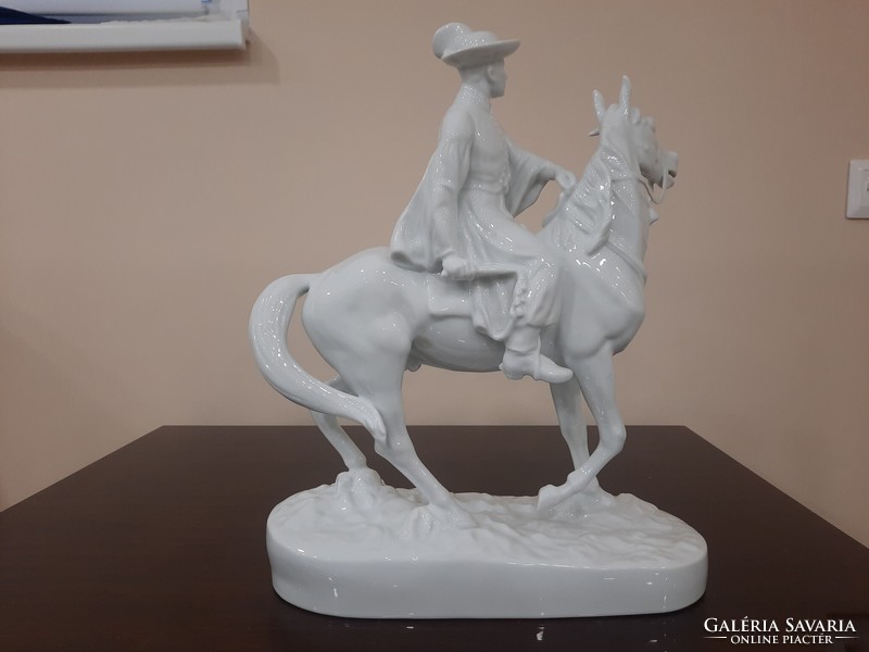 White Herend mounted hussar, porcelain figure on foal horse
