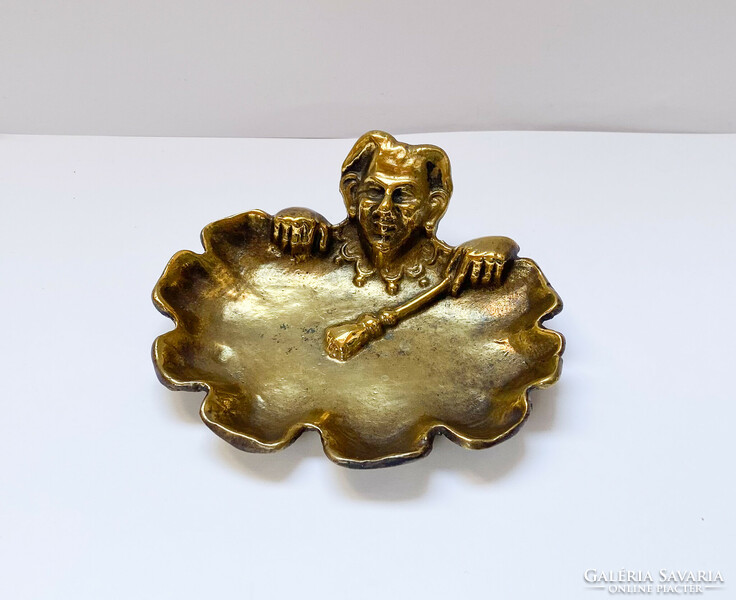 Old bronze bowl with joker figure.