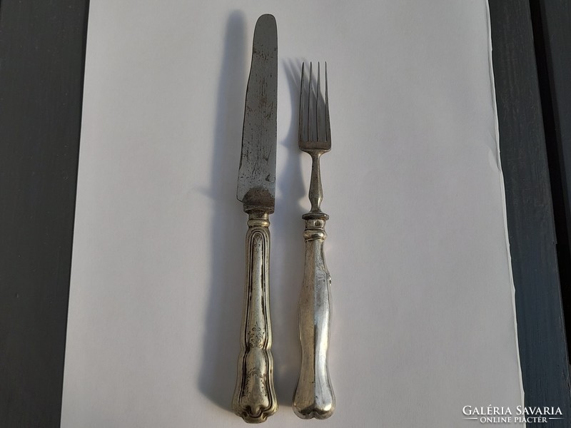 Silver-handled knife and fork in one