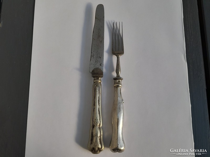 Silver-handled knife and fork in one