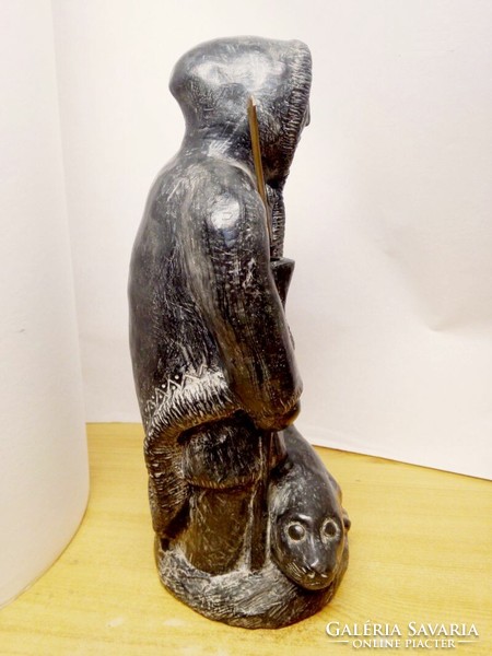 Inuit seal hunter armed with his prey wolf original signed soapstone small sculpture