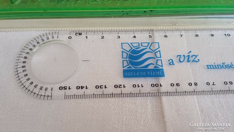 A solar calculator and a pair of rulers together