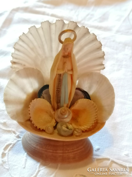 Old-style Virgin Mary amulet made of shells, pilgrim's souvenir