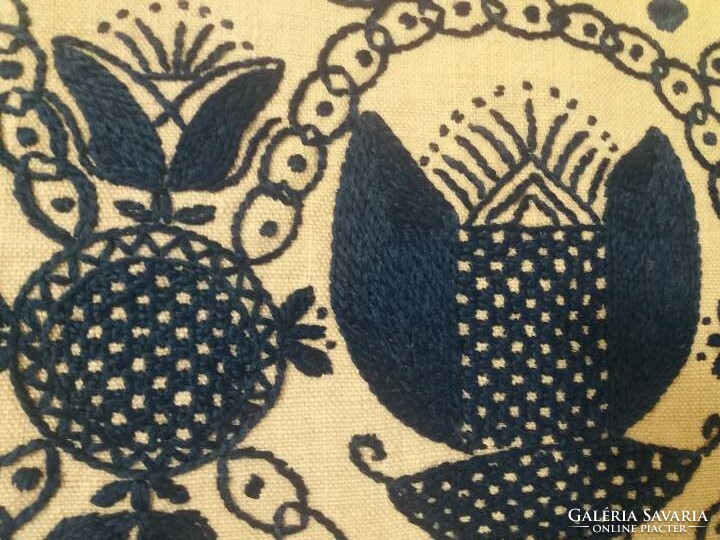 Old, pomegranate-patterned, sewn decorative cushion cover for a chair
