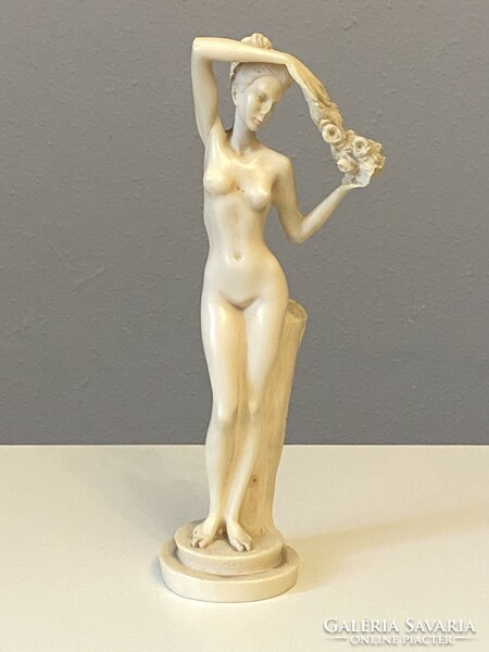 Dancing nude female nude cast bone colored plastic statue 29 cm