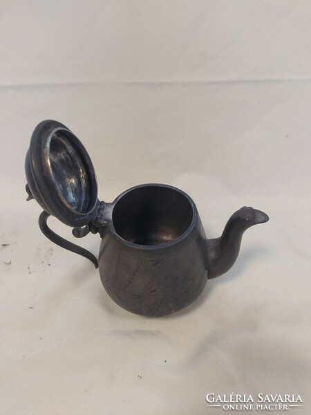 Antique metal spout with lid