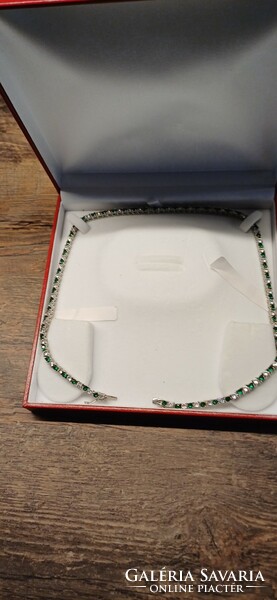 Incredibly flashy silver necklaces with synthetic emeralds.