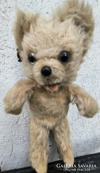 Antique retro teddy bear marked on the ear with a toothed wien, straw teddy bear
