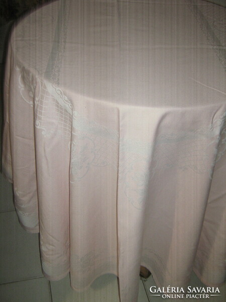 Beautiful pink oval damask tablecloth with a rose pattern
