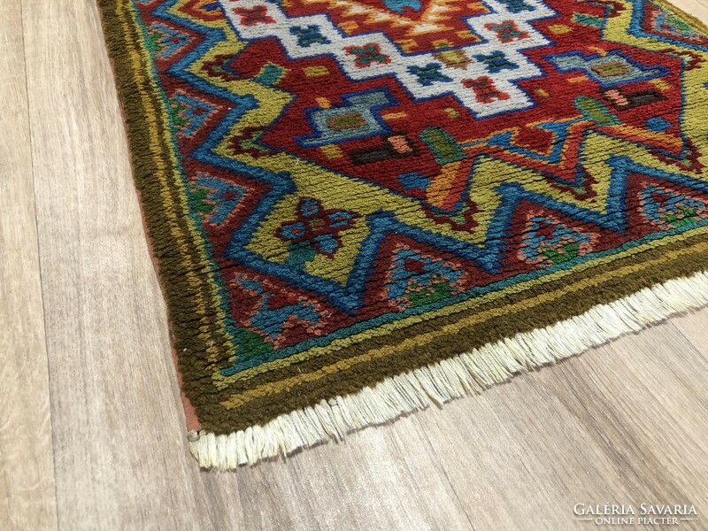 Hand-knotted wool Persian rug, 68 x 106 cm