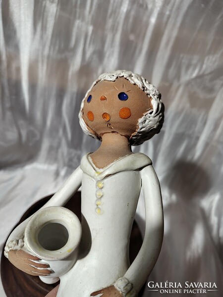 Painted ceramic statue / girl with a jug