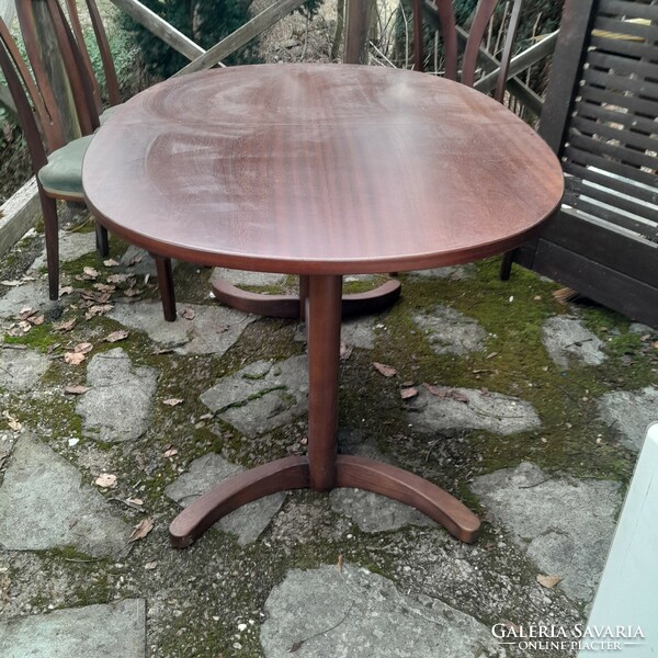 Teak dining room with 6 chairs and an extendable oval table
