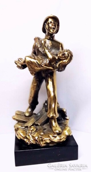 Child rescue firefighter, sports relic with a bronze effect