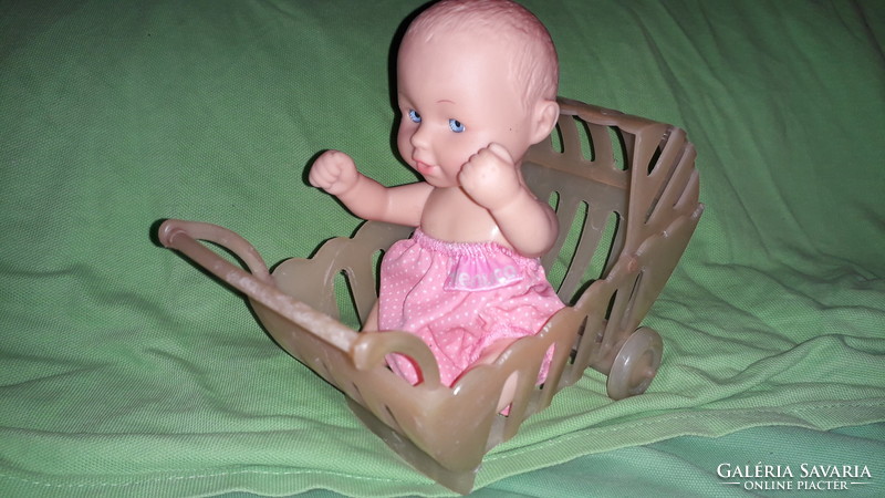Retro vinyl stroller and cradle toy set with a quality serial numbered doll as shown in the pictures