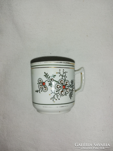 Vintage coffee cup with a plastic embossed pattern