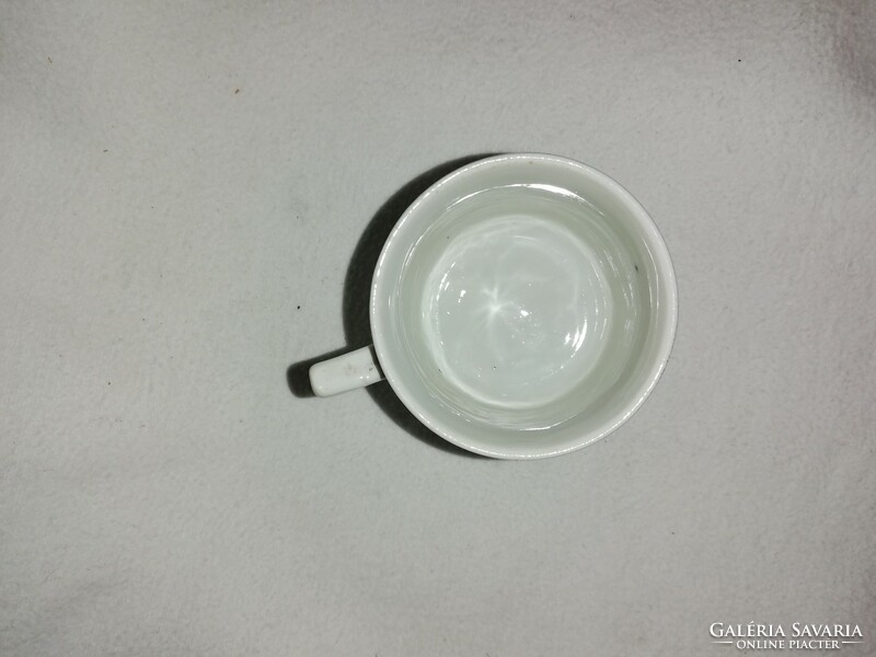 Vintage coffee cup with a plastic embossed pattern