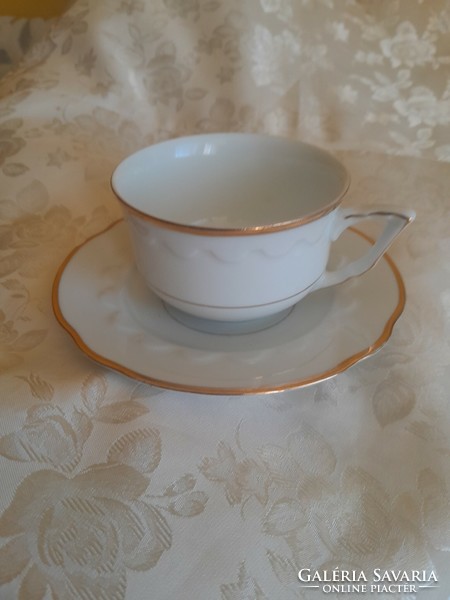 Golden teacup with teacup