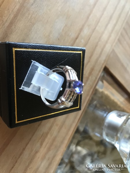 White gold ring with tanzanite and tiny diamonds
