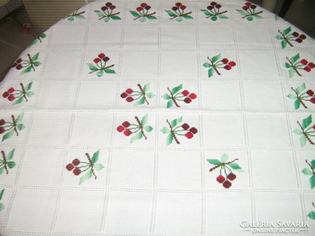 Beautiful cross-eyed cherries on a white tablecloth