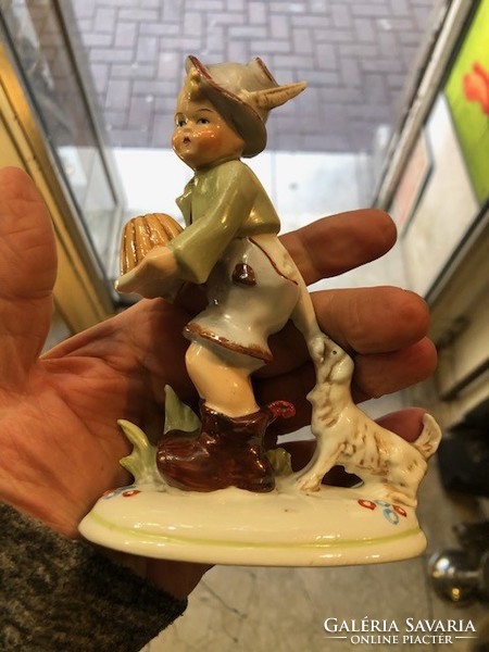 German porcelain statue of a little boy with a bowler hat, with a dog, 12 cm in size.