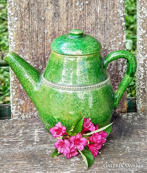 Antique ceramic jug with lid