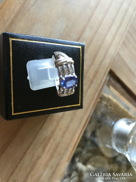 White gold ring with tanzanite and tiny diamonds