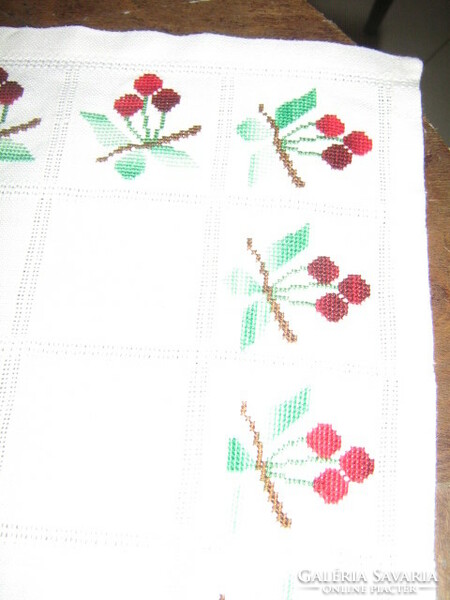 Beautiful cross-eyed cherries on a white tablecloth