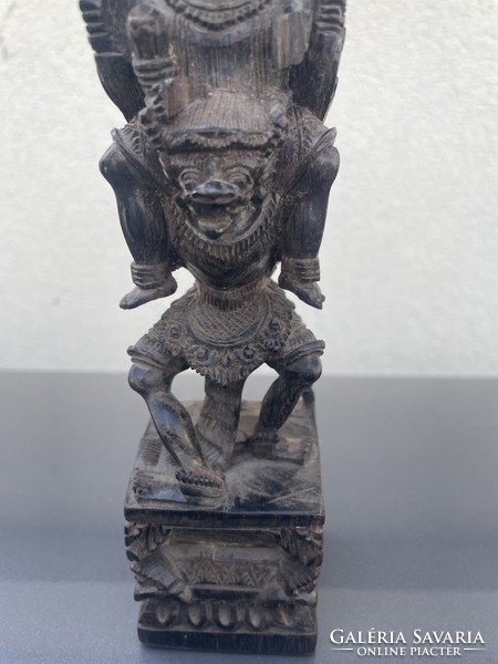 Eastern v. South American deity, richly carved wooden statue