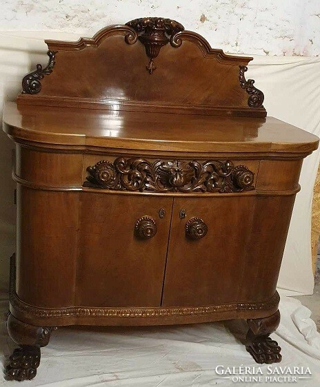A very old chest of drawers with lion feet!