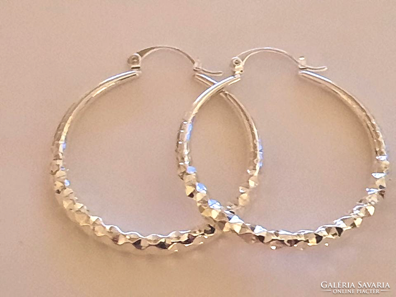 Large, silver-plated hoop earrings