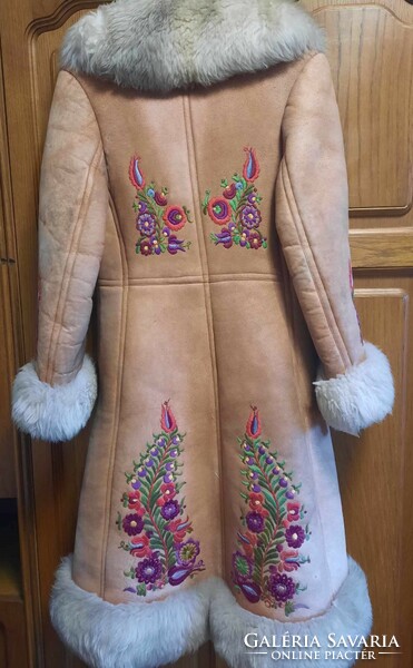 A unique fur coat designed by a folk artist, embroidered with a special kun motif