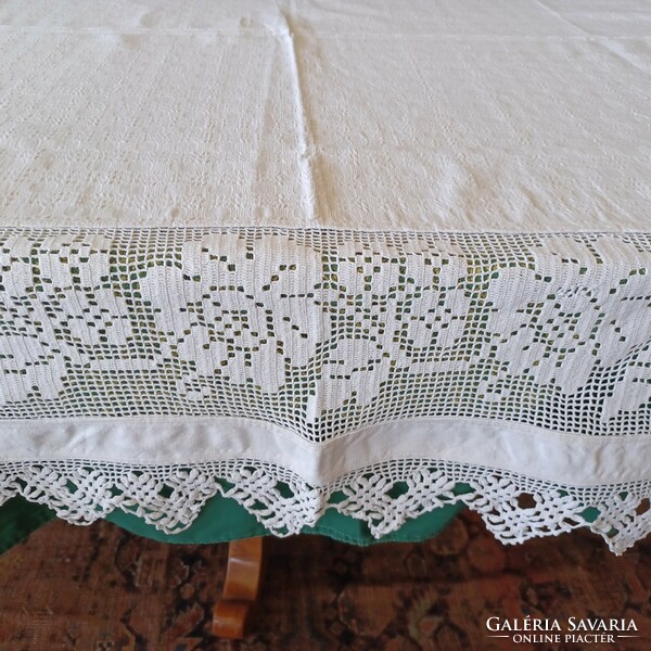 Antique handmade linen tablecloth with wide lace inserts and border