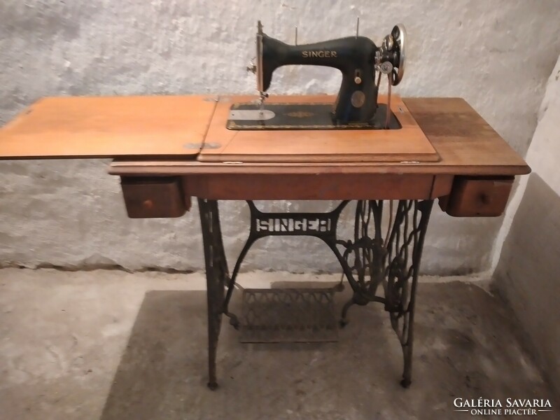 Old singer sewing machine with stand for sale, sealed