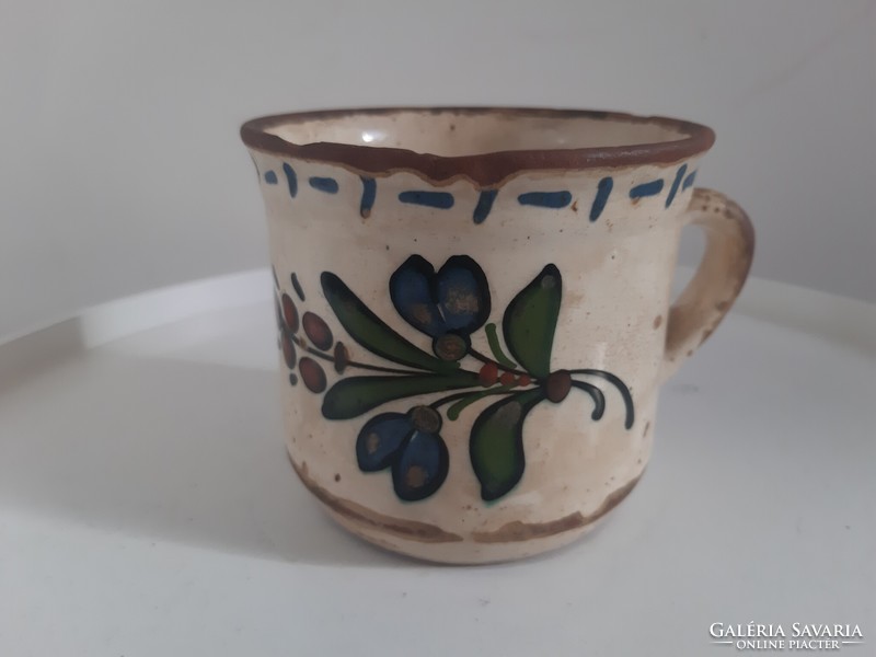 Old painted hard earthenware, ceramic milk mug