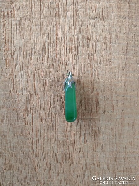 Jade pendant in a metal socket