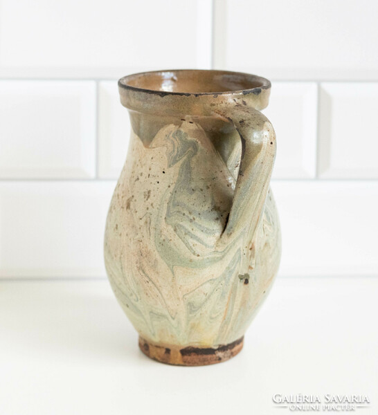 Old ceramic jug with a marble-patterned glaze, pitcher, pitcher