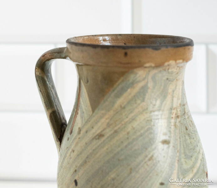 Old ceramic jug with a marble-patterned glaze, pitcher, pitcher