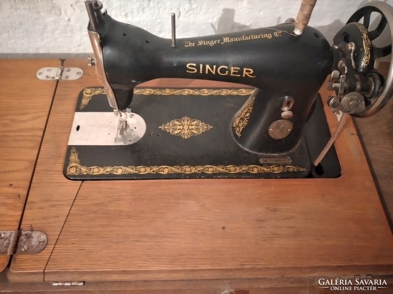 Old singer sewing machine with stand for sale, sealed