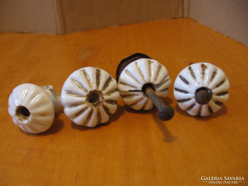 Old porcelain drawer knobs in one