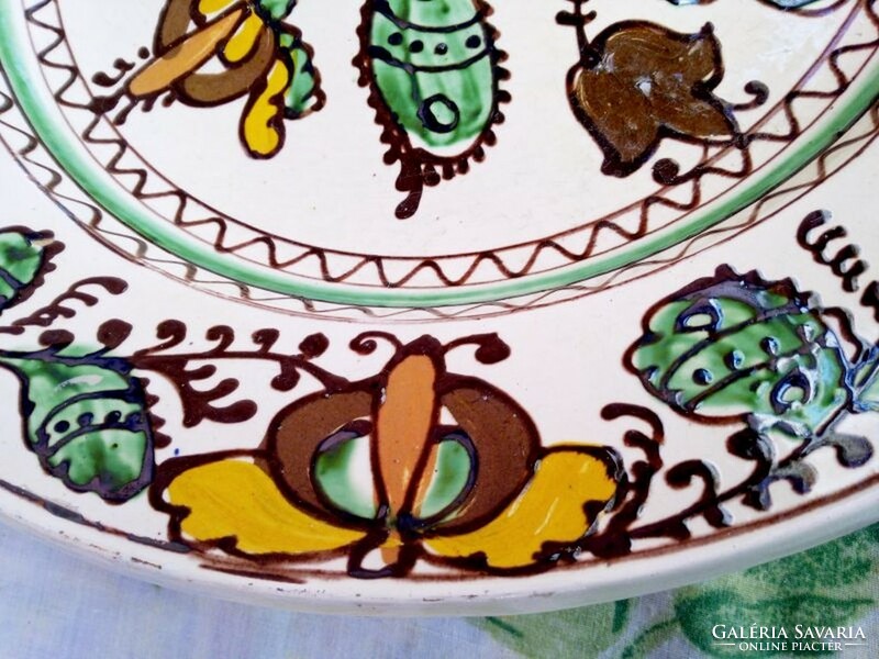 A giant Korund wall plate with a flower pattern. Handmade with folk art motifs. A unique rarity