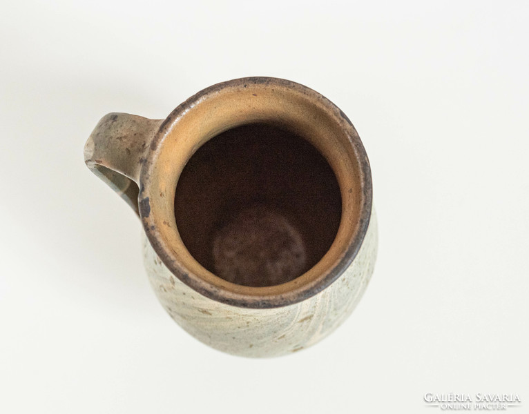 Old ceramic jug with a marble-patterned glaze, pitcher, pitcher