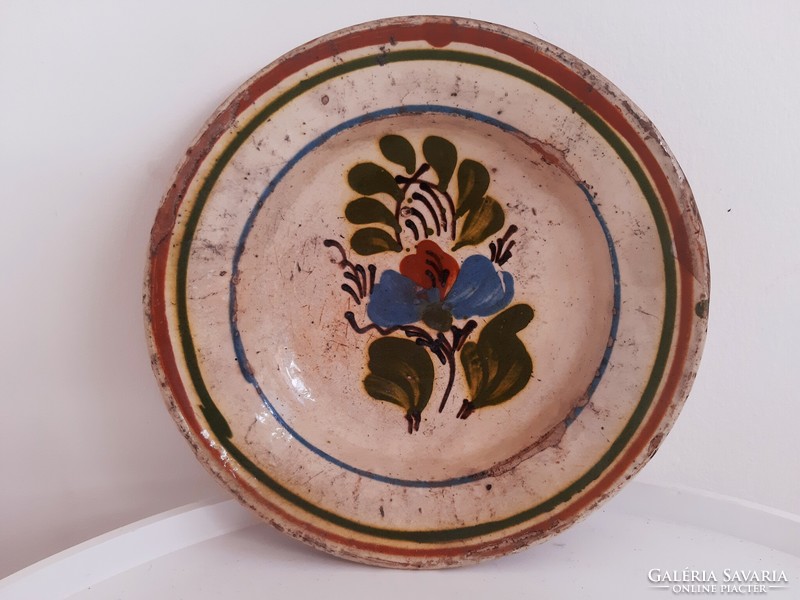 Old painted hard tile, ceramic wall plate