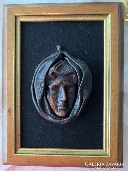 Applied art leather wall picture, plastic head in a wooden frame