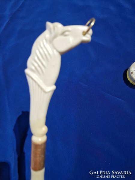 Brush with a handle decorated with a horse's head