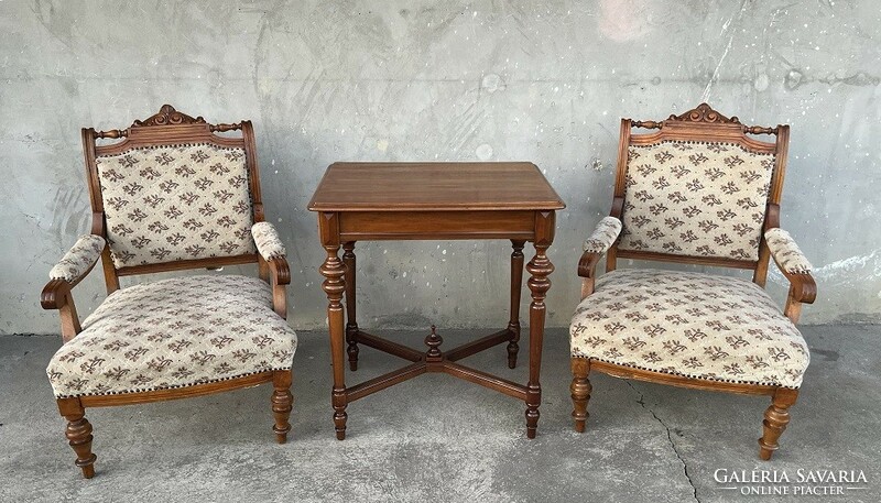Pewter carved armchairs, armchairs paired with a table