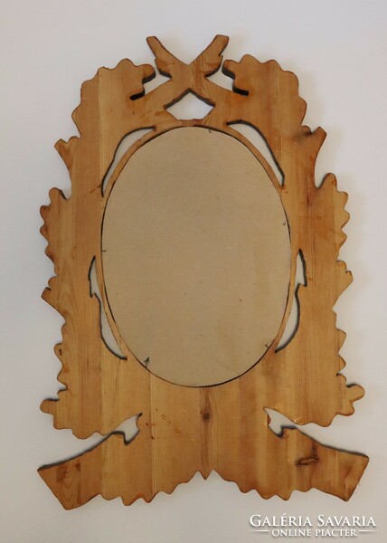 Mirror in a carved wooden frame, decorated with a hunting motif