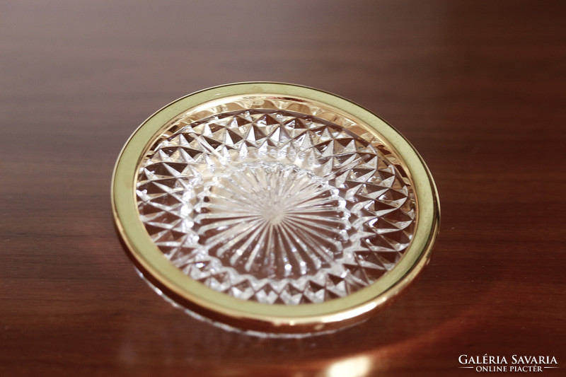 Gold-colored, metal-rimmed, crystal-like coaster